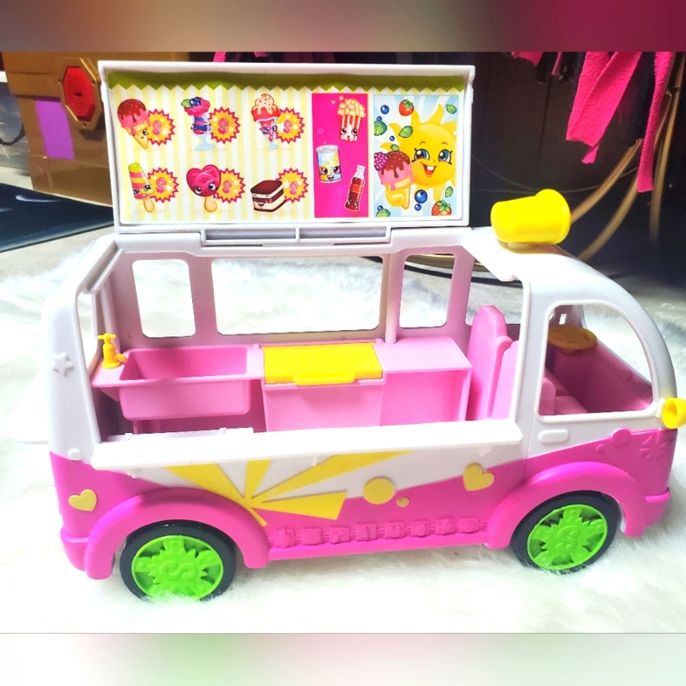 Pink and white ice cream truck bus